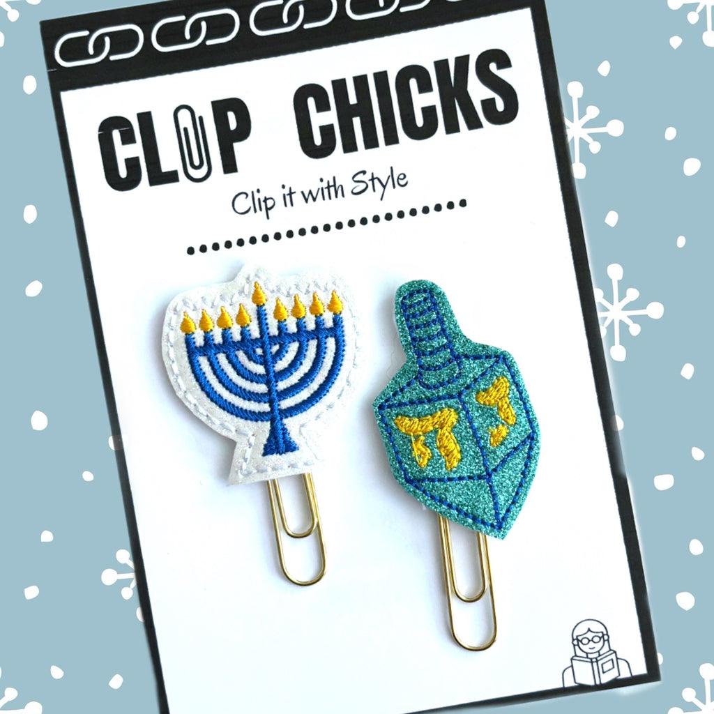 Clip Chicks' Dreidel and Menorah set of novelty paper clips are shown in its packaging.