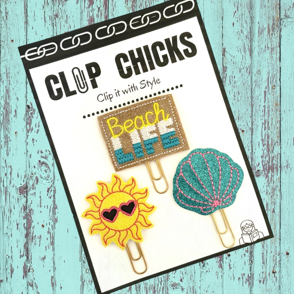 Beach life trio of novelty paper clips from Clip Chicks are shown packaged and ready to ship for summertime  reading and journaling fun.