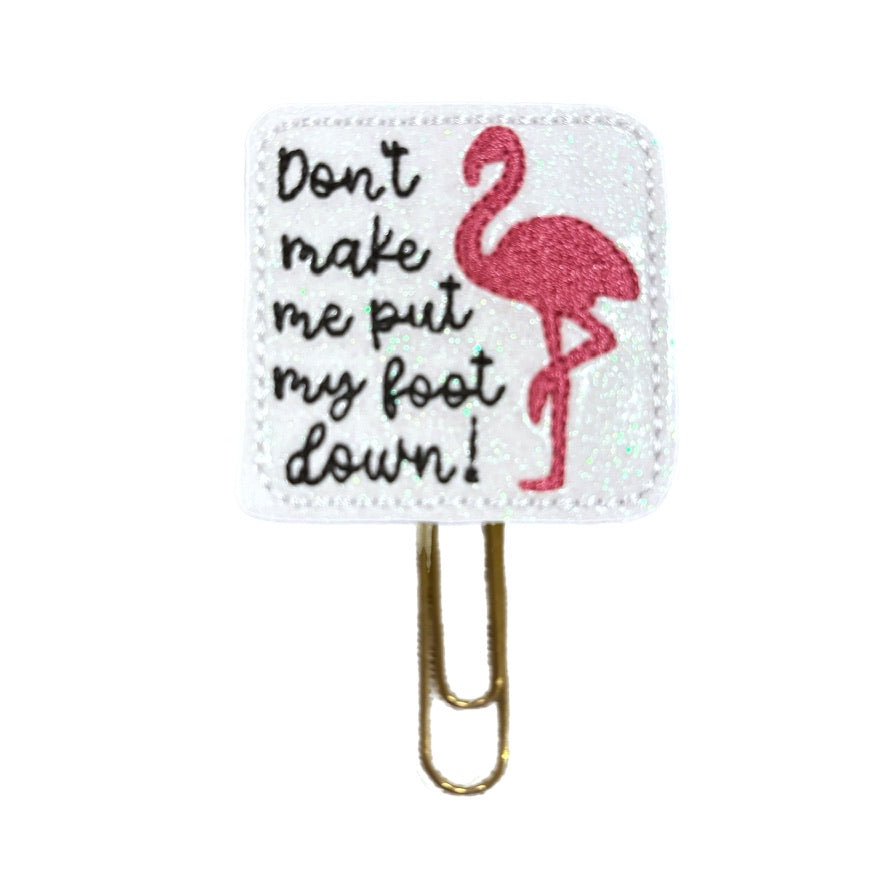 Don't make Me Put My Foot Down novelty paper clip from Clip Chicks makes a great gift for mom or a student. The feltie has a pink flamingo embroidered on it along with the saying, and is attached to a gold toned paper clip.