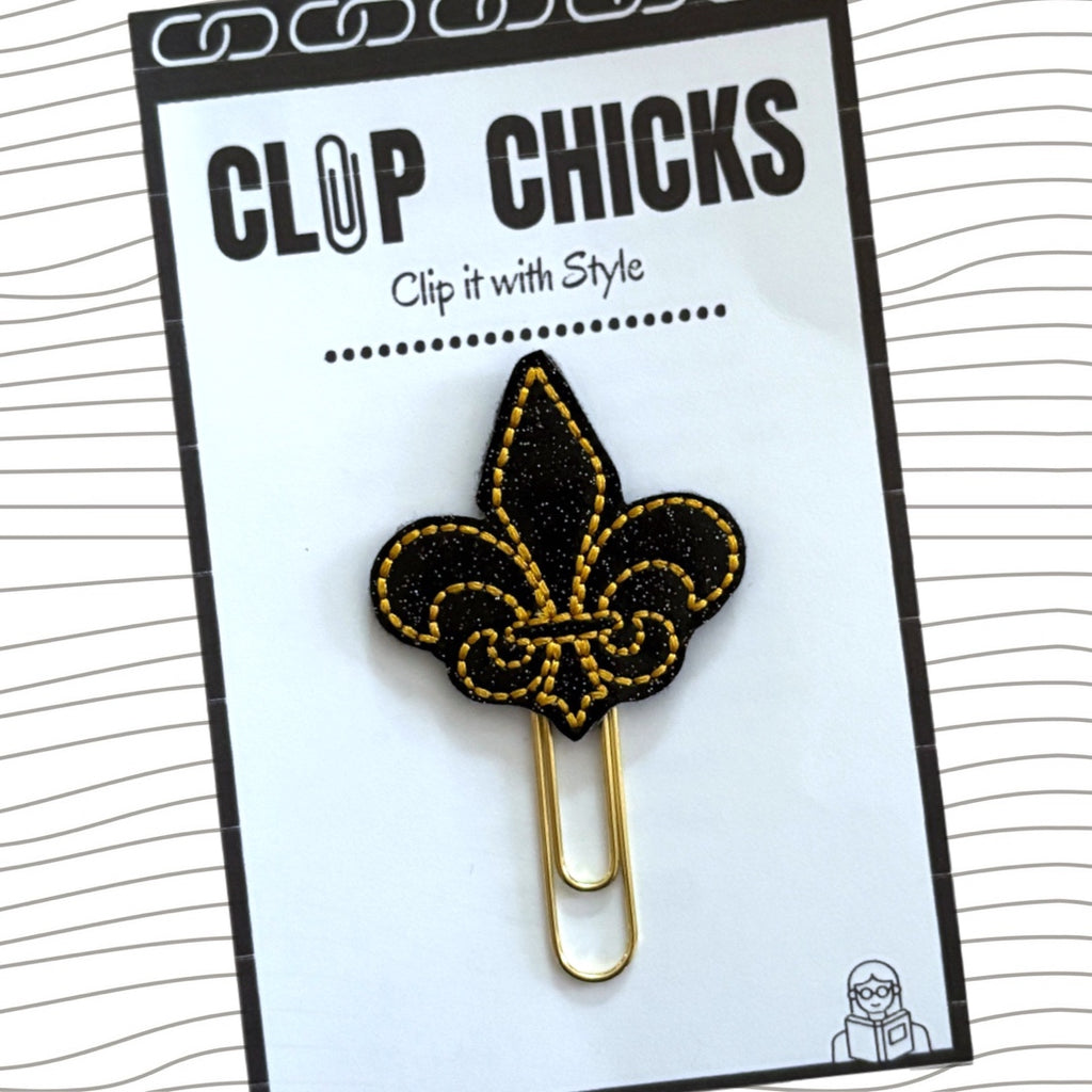 Clip Chicks' black and gold Fleur de Lis novelty paper clip is shown in its package.