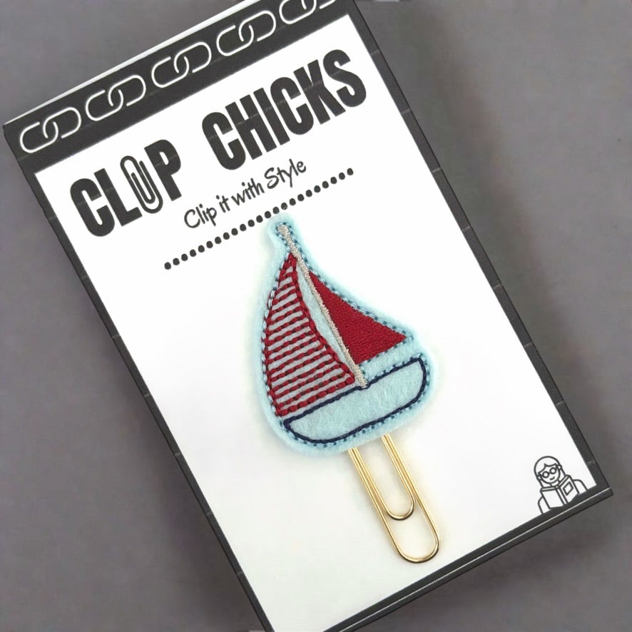 Sailboat novelty paper clip from Clip Chicks, shown in its packaging, ready for gifting.