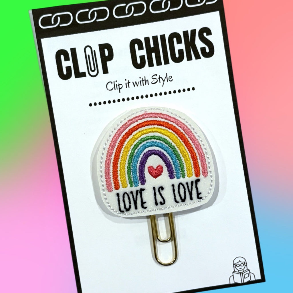 Clip Chicks' Pride themed, Love is Love novelty paper clip is shown in its package.