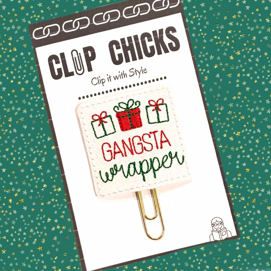 Gangsta Wrapper novelty paper clip, planner clip, paper organizer is shown on a green background with small stars.