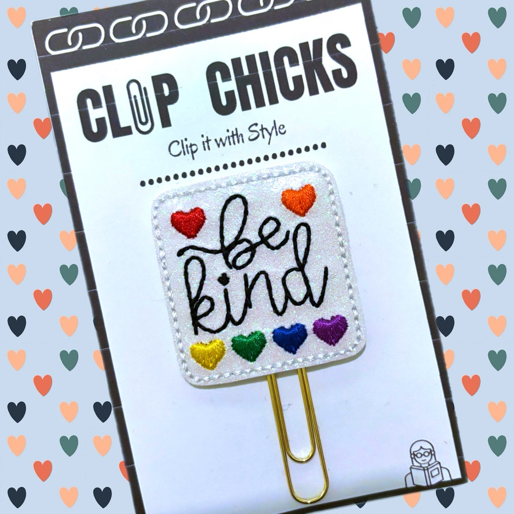 Clip Chicks' novelty paper clip has Be Kind and six colored hearts embroidered on it. It is shown in its package.