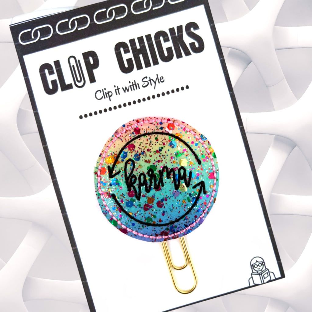 Taylor Swift inspired novelty paper clip from Clip Chicks has Karma embroidered on a glittery ombre vinyl then attached to a paper clip, for use as a bookmark, planner clip, organizer, etc.