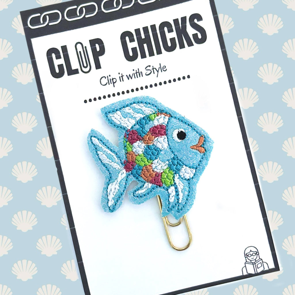 Clip Chicks' Rainbow Fish novelty paper clip/planner clip is shown in its package, ready to ship and give as a gift.