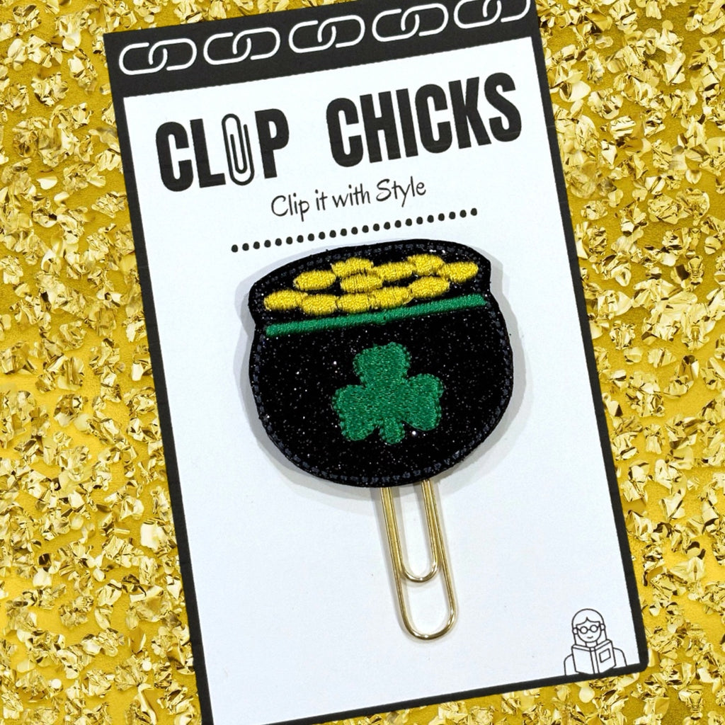 Clip chicks' Pot O'Gold novelty paper clip is shown in its package against a glittery gold background.