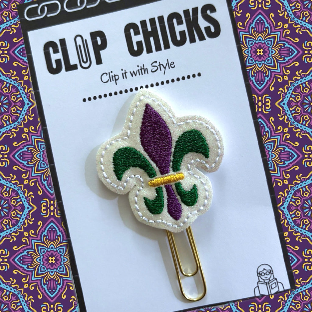 Clip Chicks' Mardi Gras Fleur de Lis novelty paper clip is shown in its package.