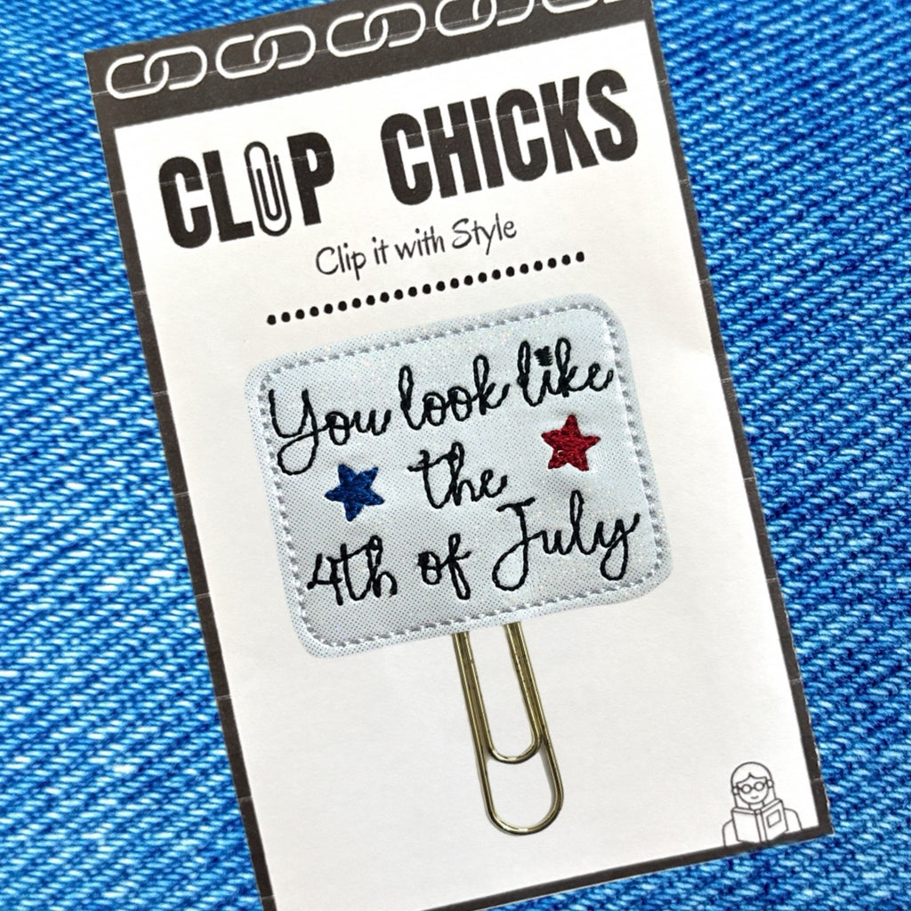 You Look Like the 4th of July novelty paper clip in its package from Clip Chicks LLC sits on a denim background. The quote is from the movie, Legally Blonde 2.