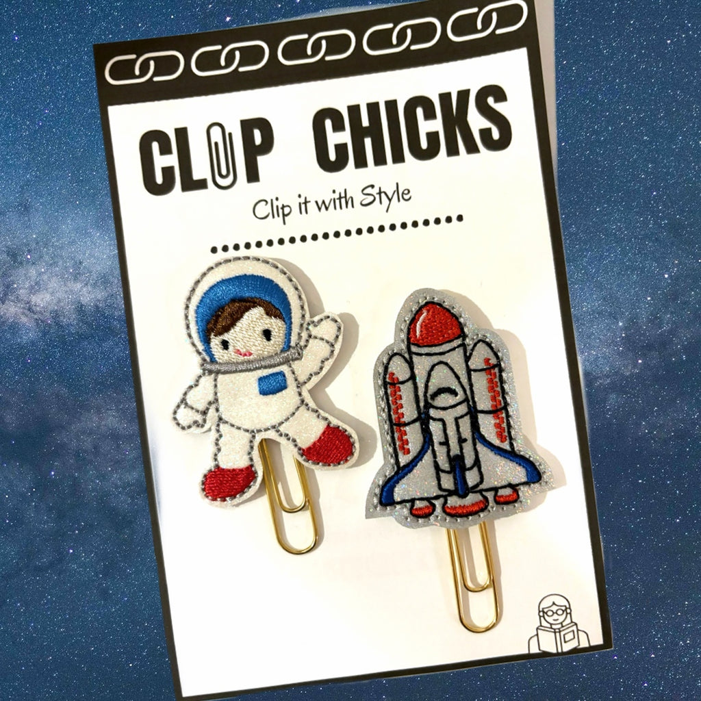 Clip Chicks' Astronaut and Space Shuttle set of novelty paper clips is shown in its packaging, shown against a space background.