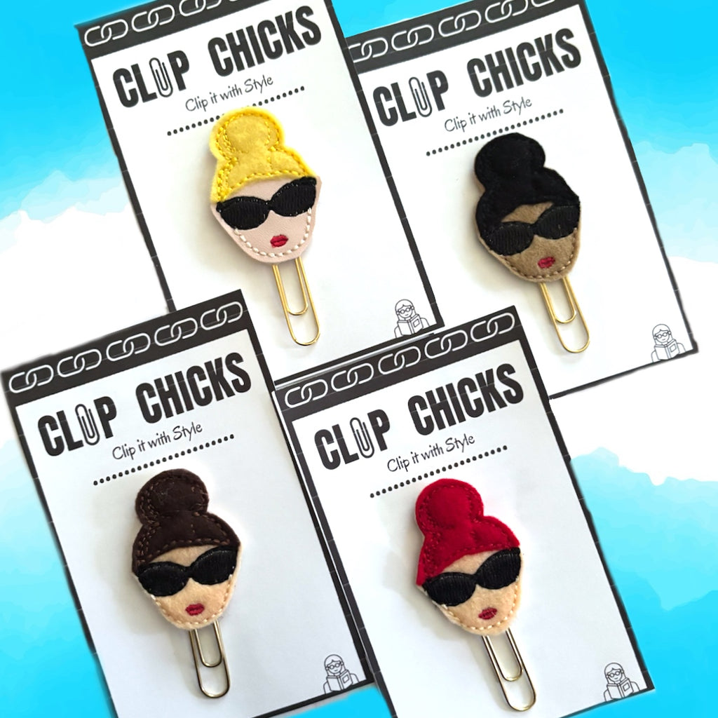 Bun girl Clip Chicks novelty paper clips are shown in their packages.