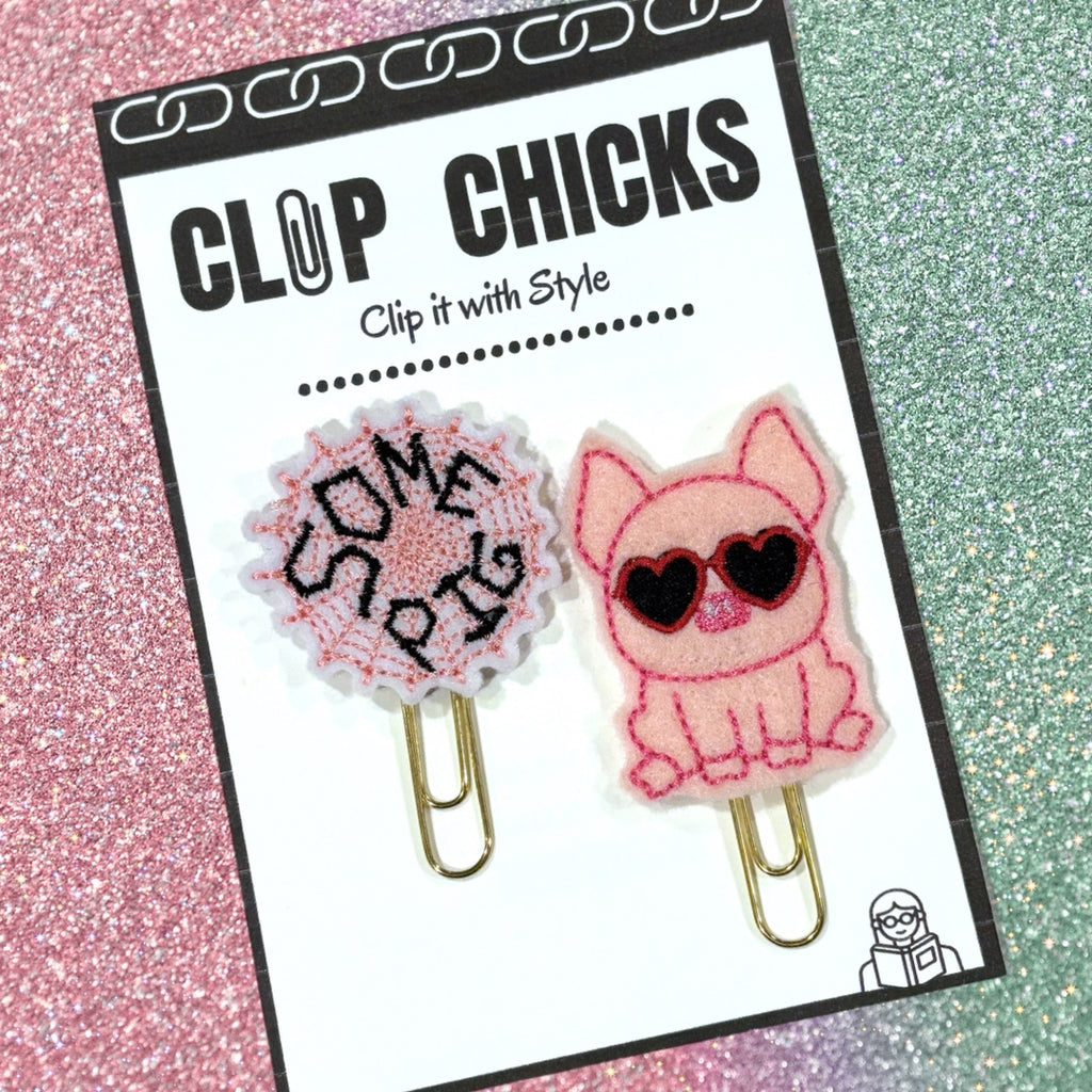 Clip Chicks Some Pig novelty paper clips are shown in its packaging.