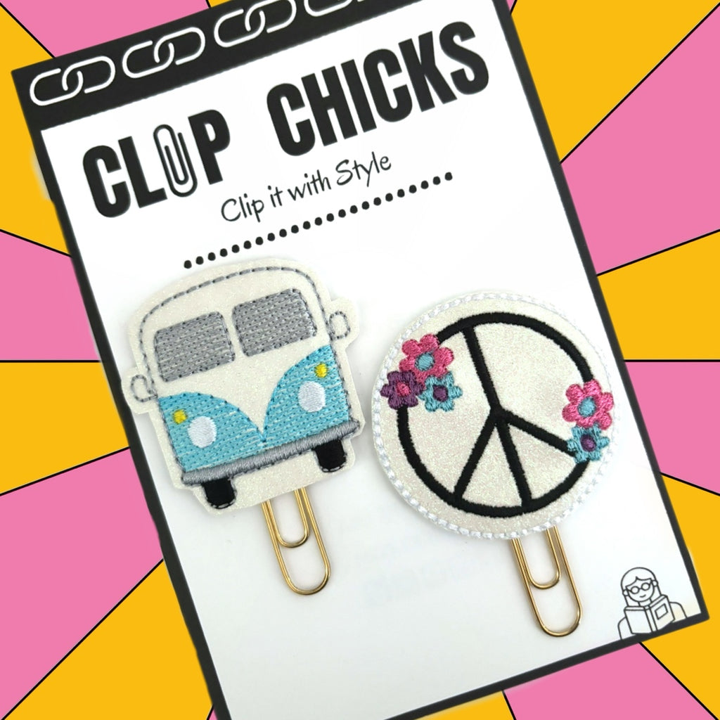 Set of 2 novelty paper clips from Clip Chicks are shown in their package, set includes a 60's style peace sign and a vw van paper clip which are great as bookmarks, planner clips and paper organizers.