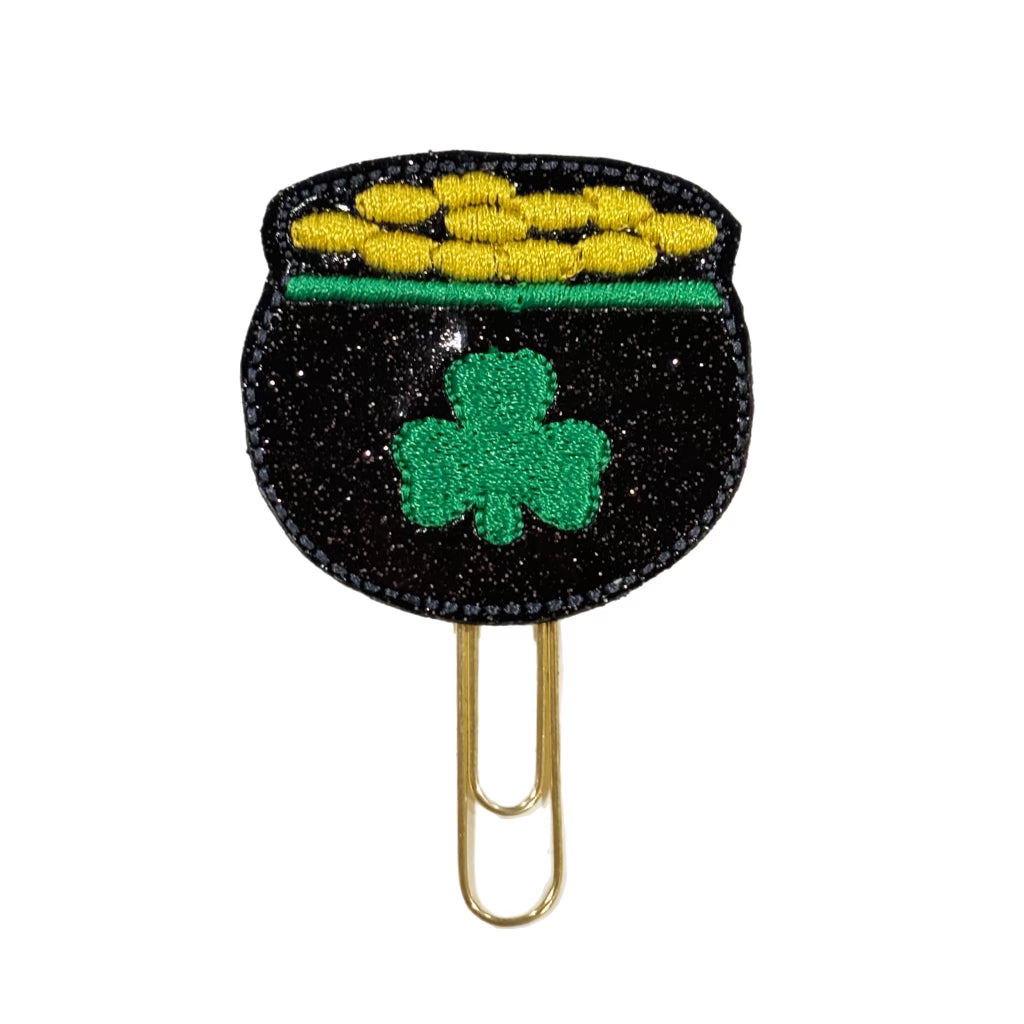 A Clip Chicks novelty paper clip shaped like a pot of gold for St. Patrick's day.