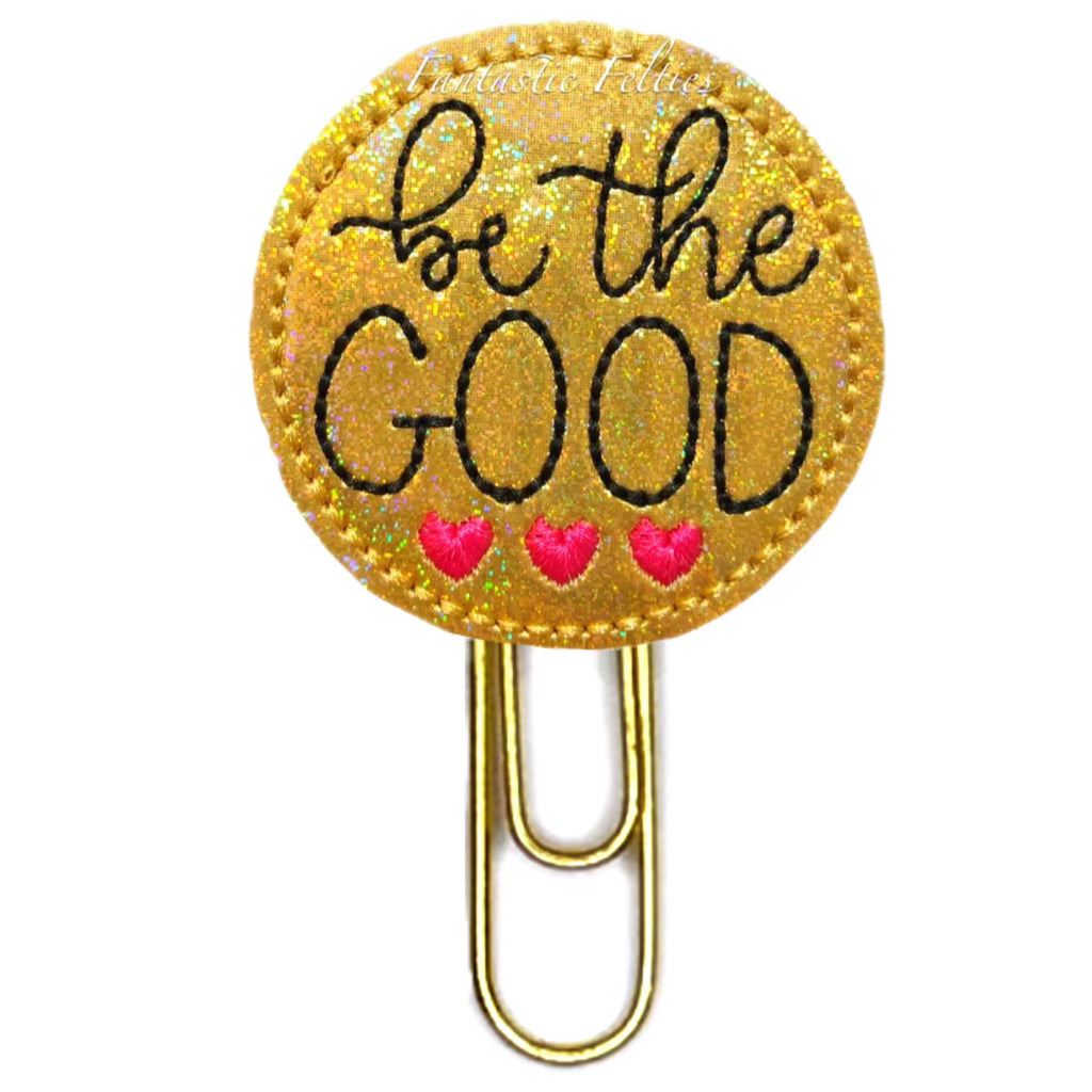 Be the Good shiny gold novelty paper clip is embroidered with three little pink hearts.