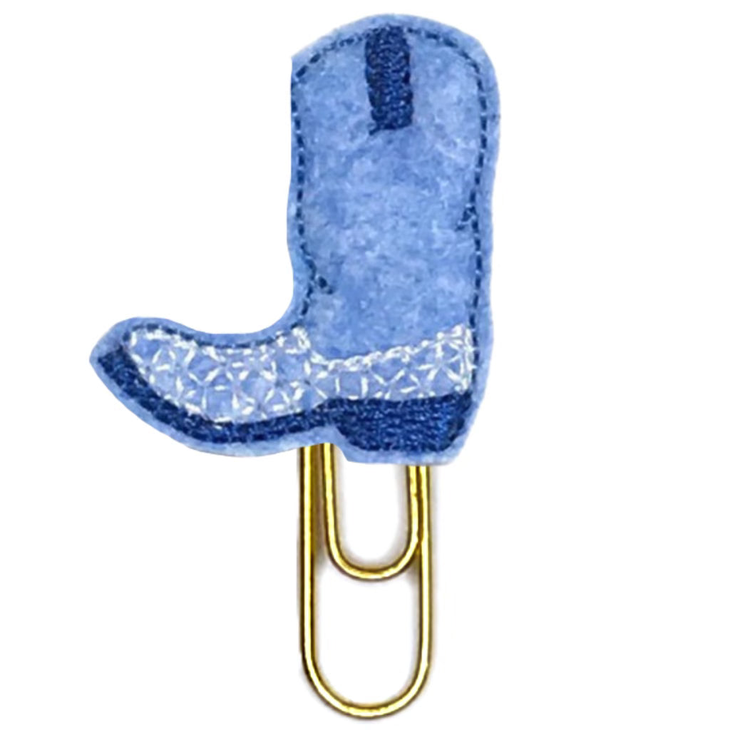 Denim blue cowboy boot novelty paper clip on a white background.