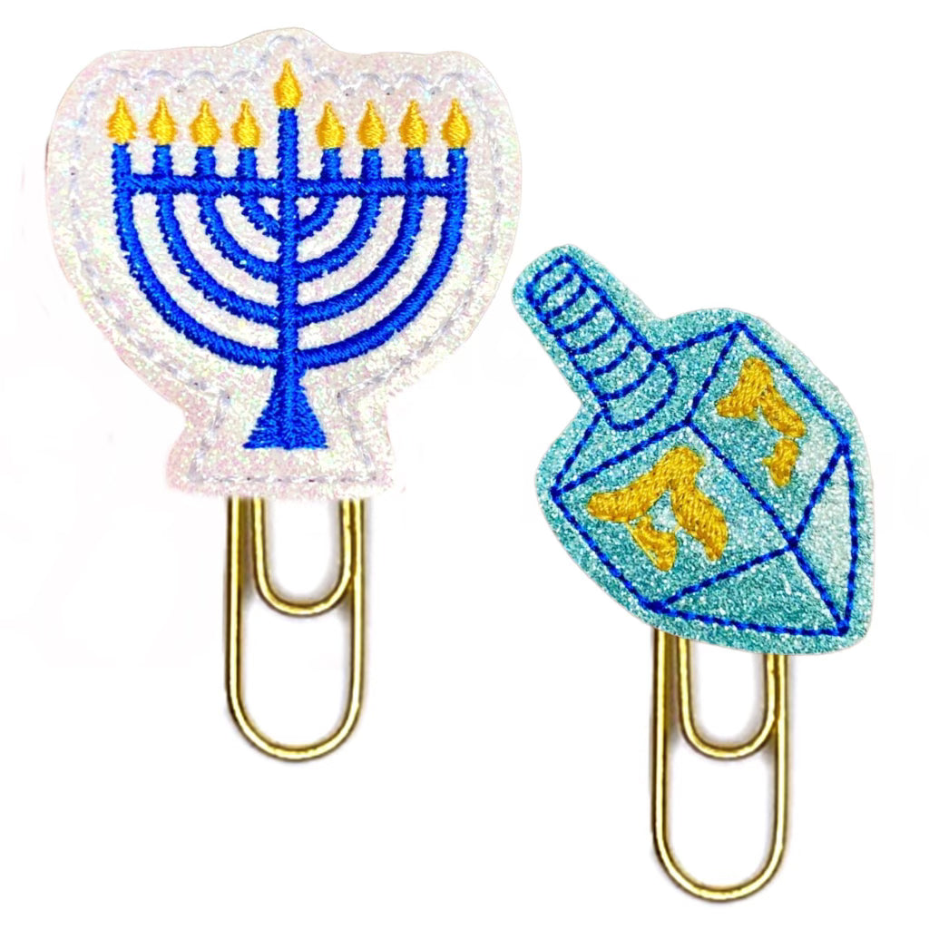 Dreidel and Menorah novelty paper clip set is shown against a white background. 