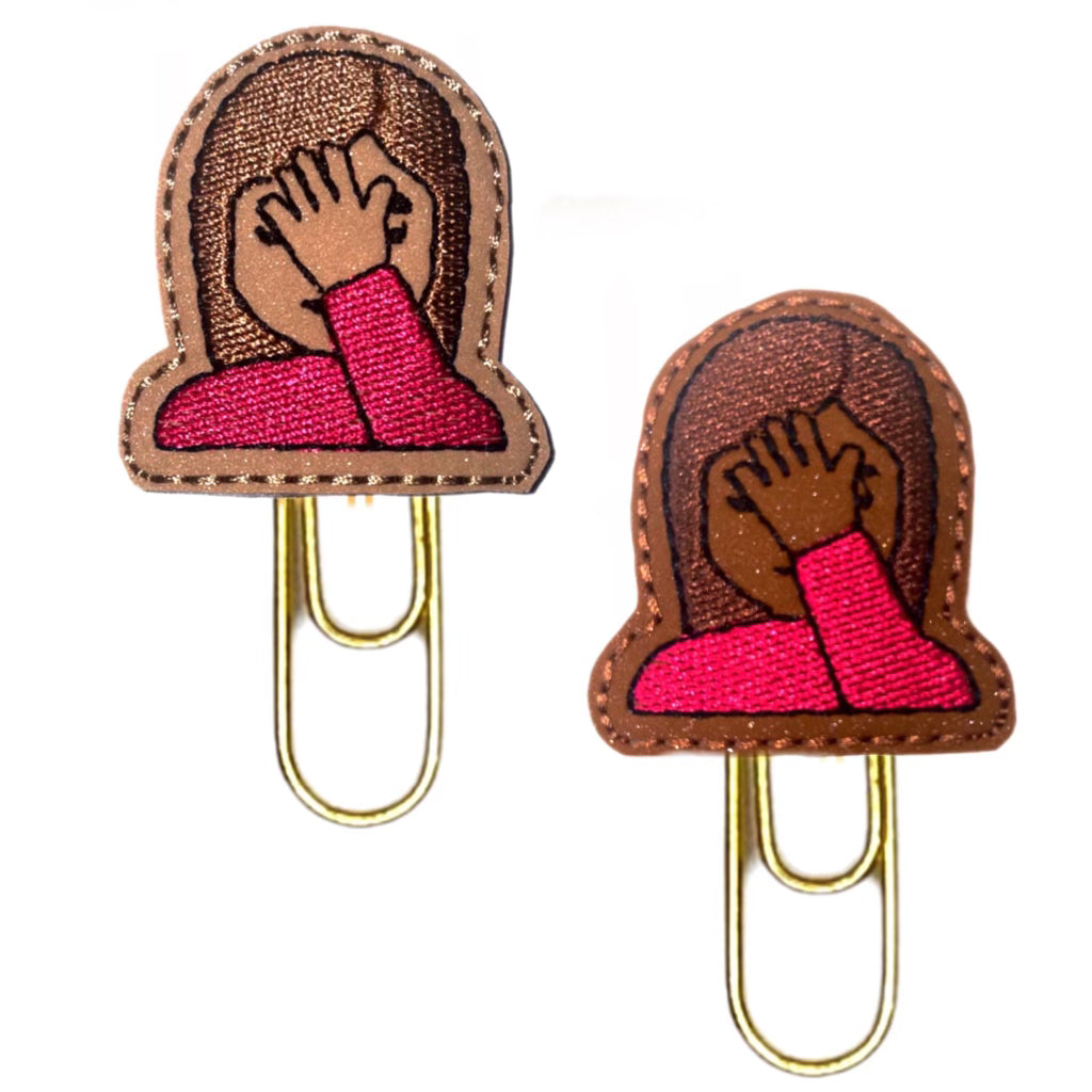 Face-Palm novelty paper clips from Clip Chicks are shown in a light and a dark skin-tone.