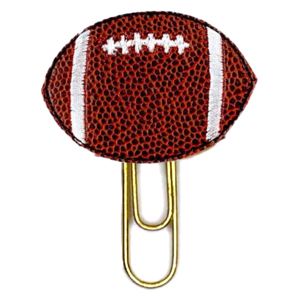 Football novelty paper clip from Clip Chicks has a textured vinyl football shaped embroidered feltie attached to a paper clip.