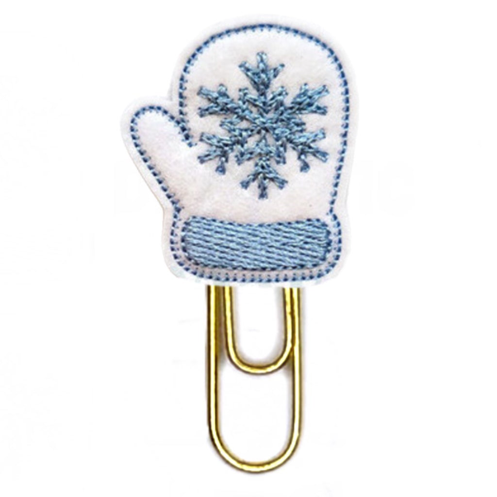 White and Blue felt shaped mitten attached to a gold toned paper clip.