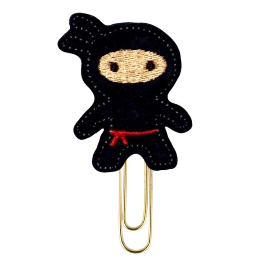 Black ninja is attached to a paper clip.