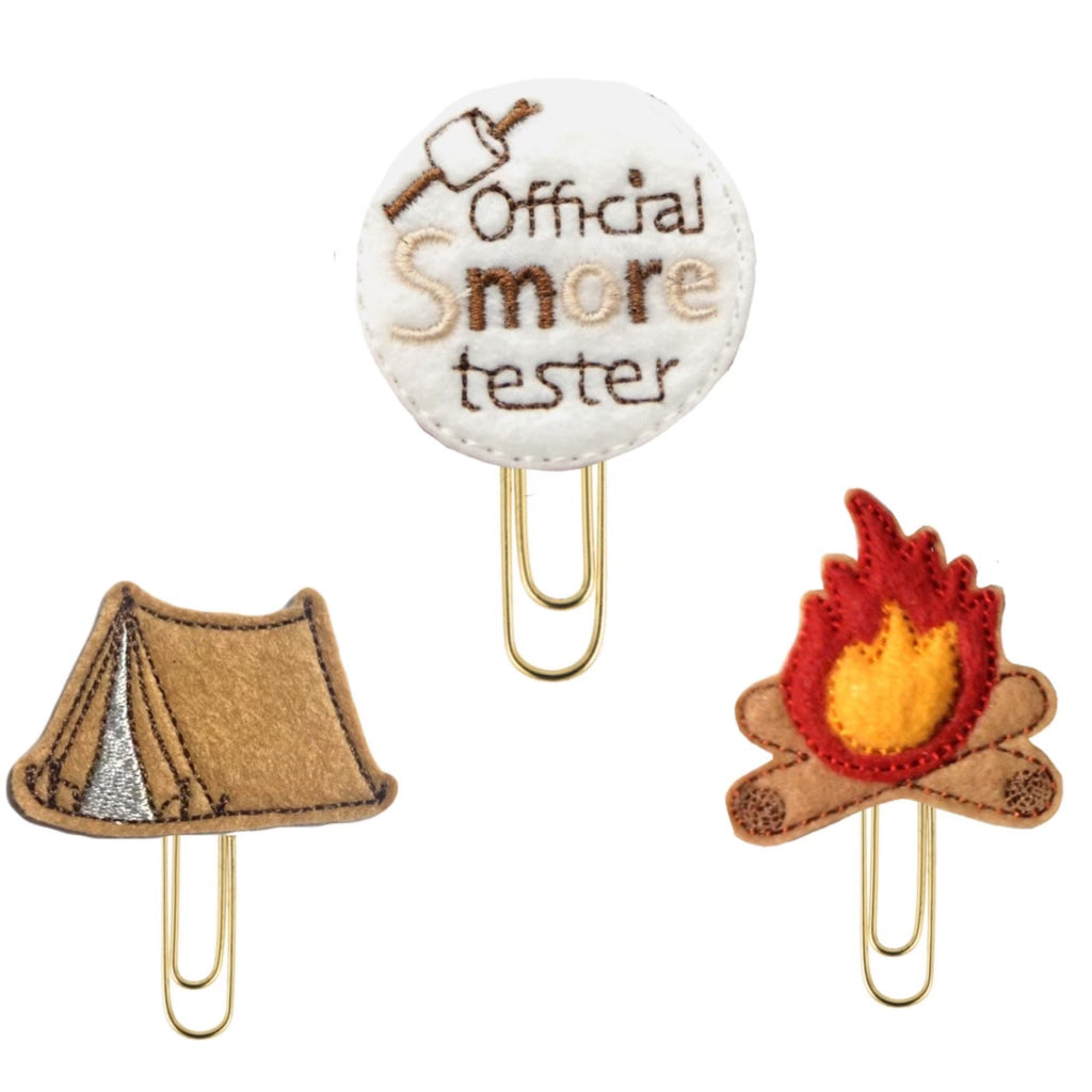 Official Smore Tester set of novelty paper clips from Clip Chicks, with a tent, a campfire and Official Smores Tester novelty paper clips. The set of three clips make great bookmarks, planner clips and organizational tools for campers.