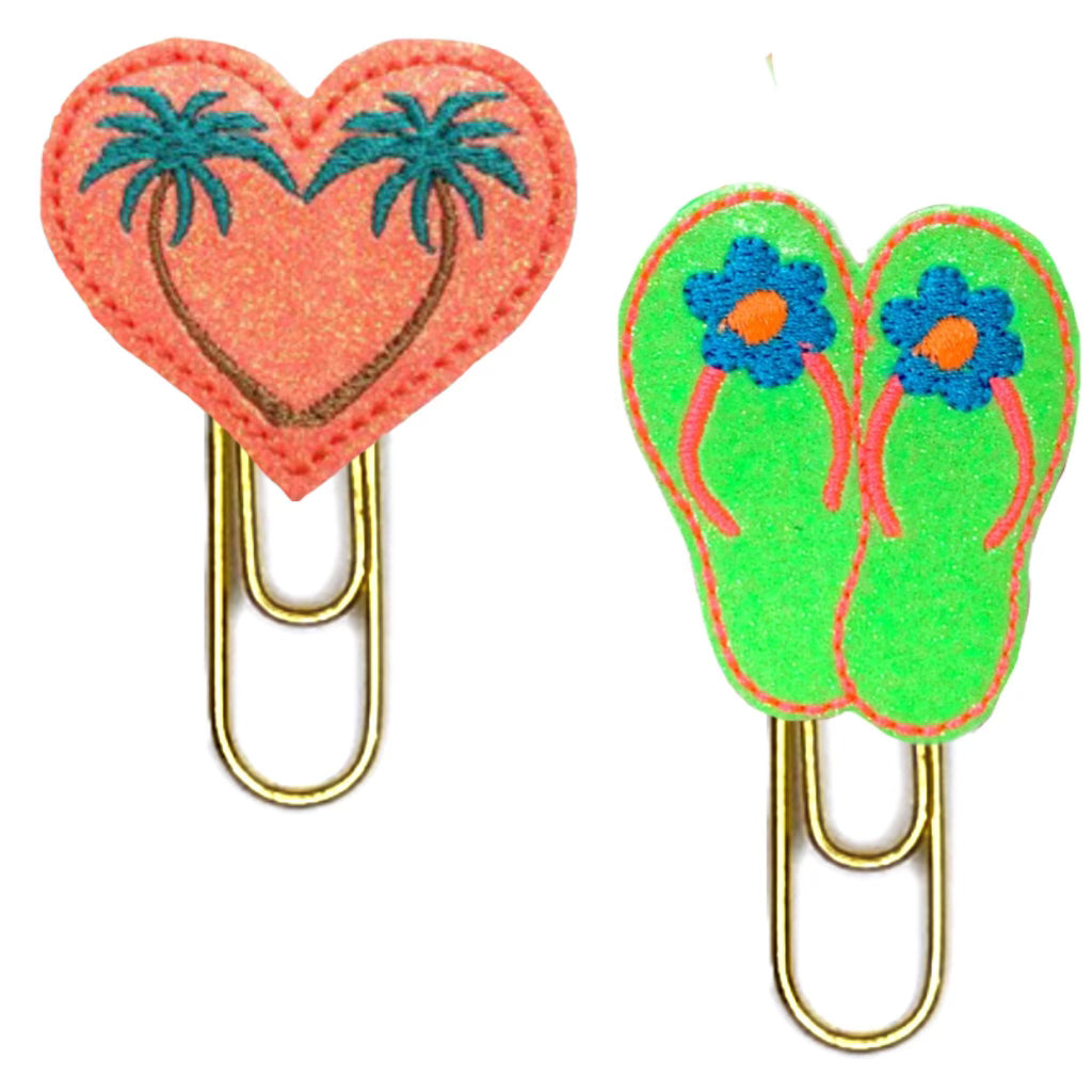 Duo of summer themed novelty paper clips from Clip Chicks, one is heart shaped with palm trees embroidered on it and the other one is shaped like a pair of bright green flip flops.