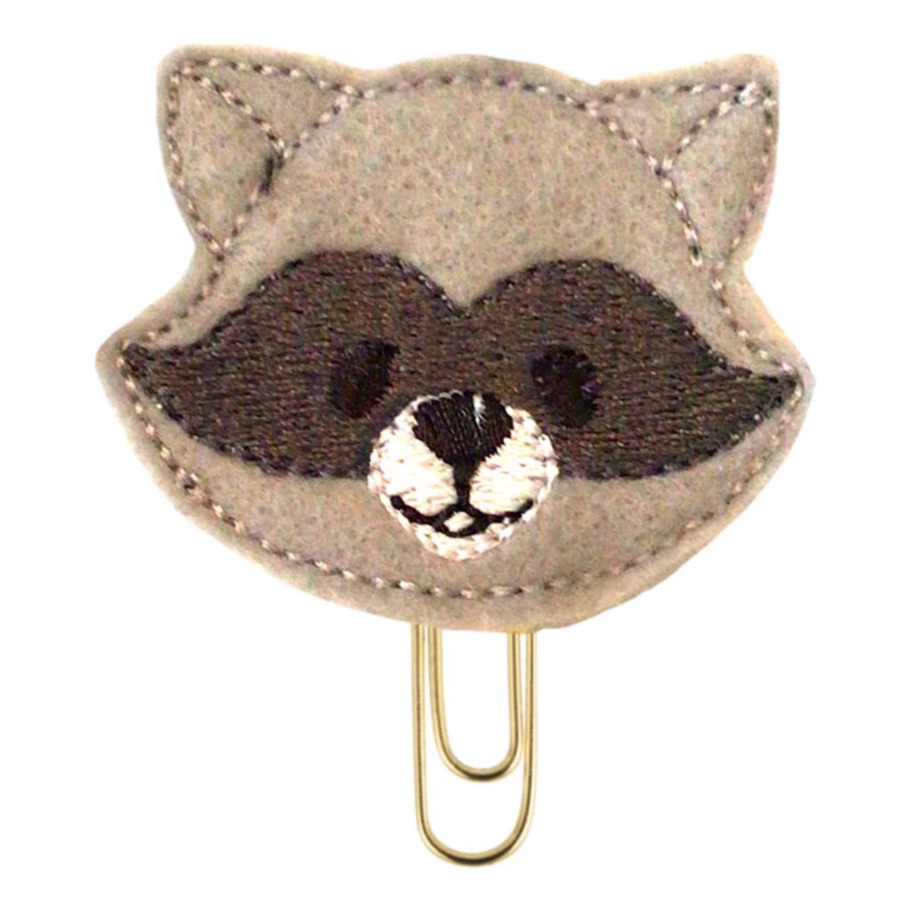 A raccoon shaped novelty paper clip is shown from Clip Chicks.