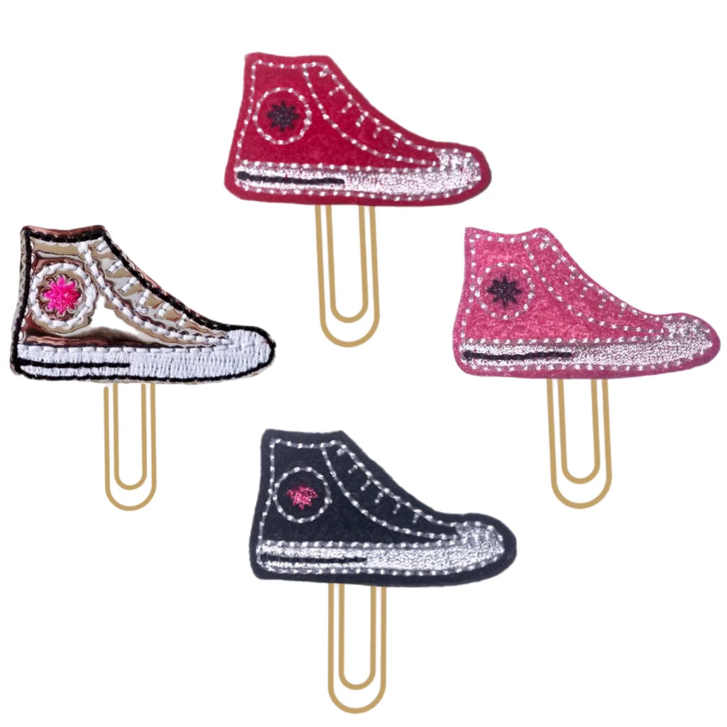 Clip Chicks' sneaker novelty paper clip is shown in each of the four available colors, black, red, pink and silver.