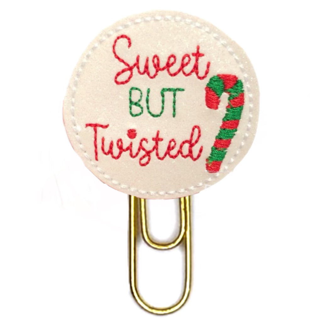 Sweet but Twisted with a candy cane embroidered on to vinyl and felt then attached to a paper clip.