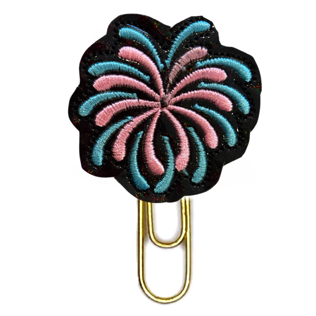 Blue and Pink Fireworks in the night sky novelty embroidered paper clip is shown on a white background.