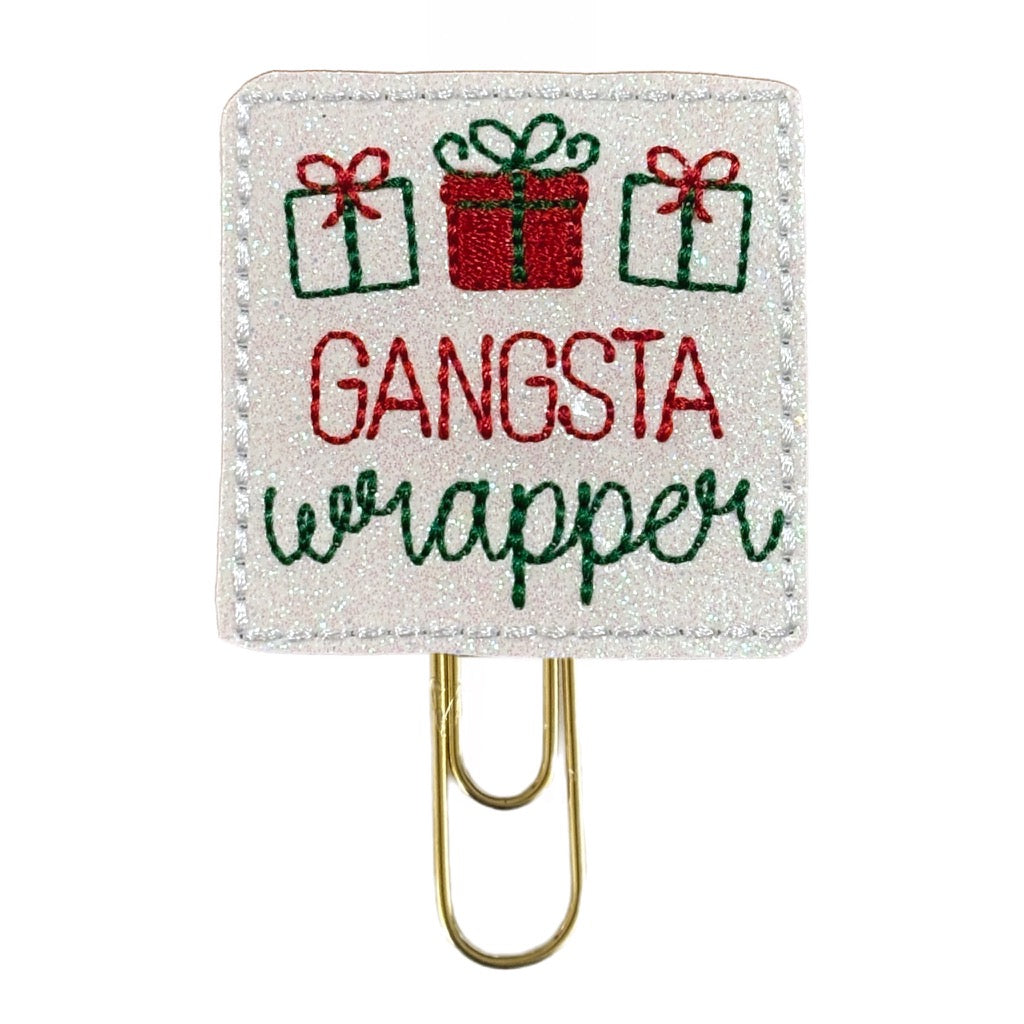 Gangsta Wrapper novelty paper clip is shimmery white vinyl background with red and green embroidery.